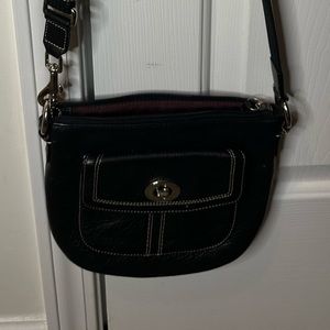 Long strap black leather COACH crossbody bag.